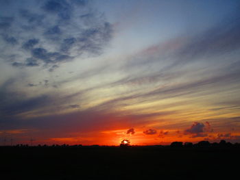 Scenic view of silhouette landscape against sky during sunset