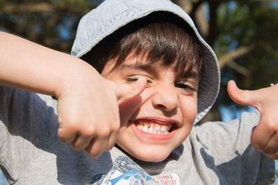 Happy boy smiling with ok gesture