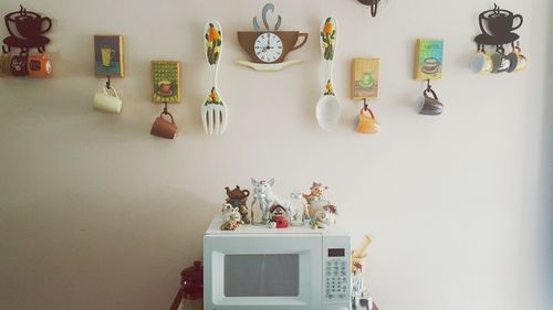 Cups and decorations on wall