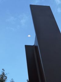 Low angle view of building against clear blue sky