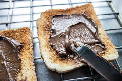 High angle view of chocolate sauce on bread slices