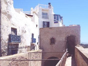 Staircase in city against sky