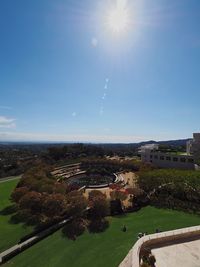 High angle view of buildings against blue sky