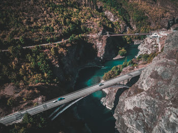 High angle view of bridge over river against trees