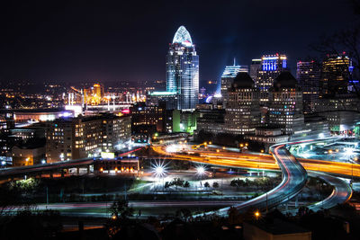 Illuminated buildings in city at night