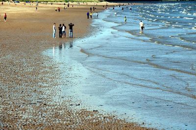 View of people standing on beach