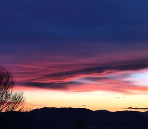 Silhouette of landscape against dramatic sky