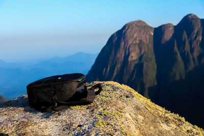 Rock on mountain against sky