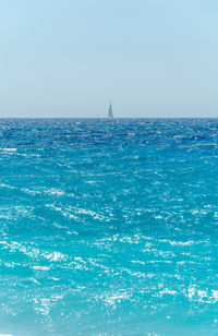 Scenic view of sea against clear blue sky