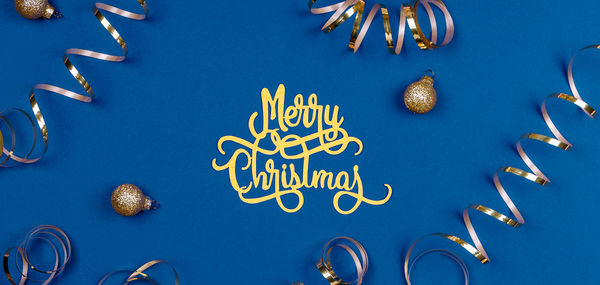 High angle view of christmas decoration on yellow background