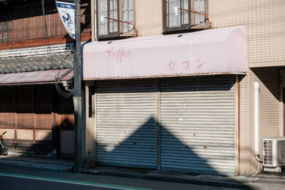 Text on closed window of building