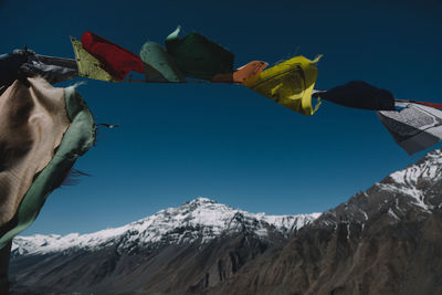 Low angle view of snowcapped mountain against sky