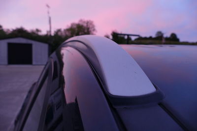 Close-up of built structure against sunset sky