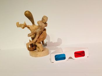High angle view of toys on table against white background