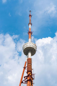 Low angle view of communications tower against sky