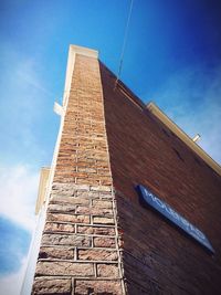 Low angle view of built structure against blue sky