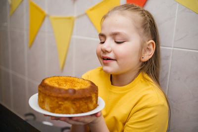 Girl with a fragrant homemade cupcake, home cooking, easter holiday