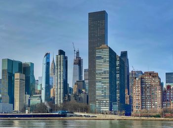 Modern buildings in city against sky