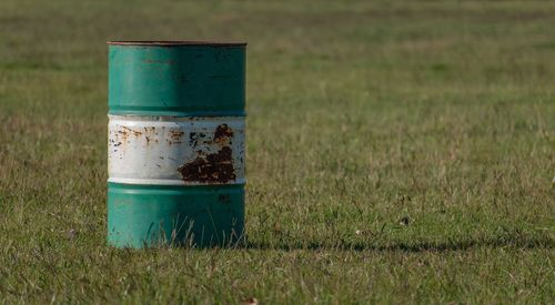 Close-up of old metal structure on field