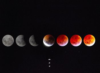 Digital composite image of moon against sky at night