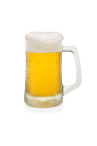 Close-up of beer glass against white background