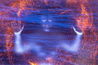 Abstract image of light trails against black background