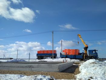 Construction site against sky during winter