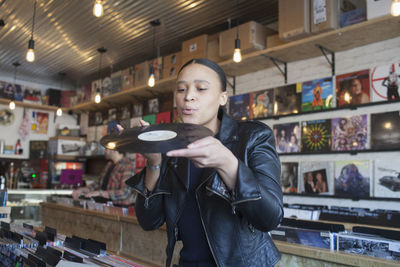 Young woman in a record store.