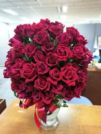 Close-up of pink roses on table