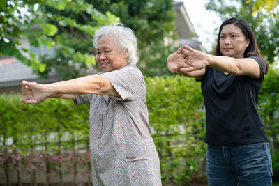 Asian senior woman patient exercise with happy fresh enjoy in park, healthy strong medical concept