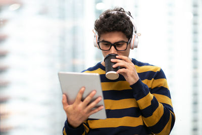 Mid adult man using mobile phone