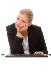 Mid adult woman working over white background