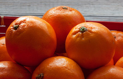 Close-up of oranges on table