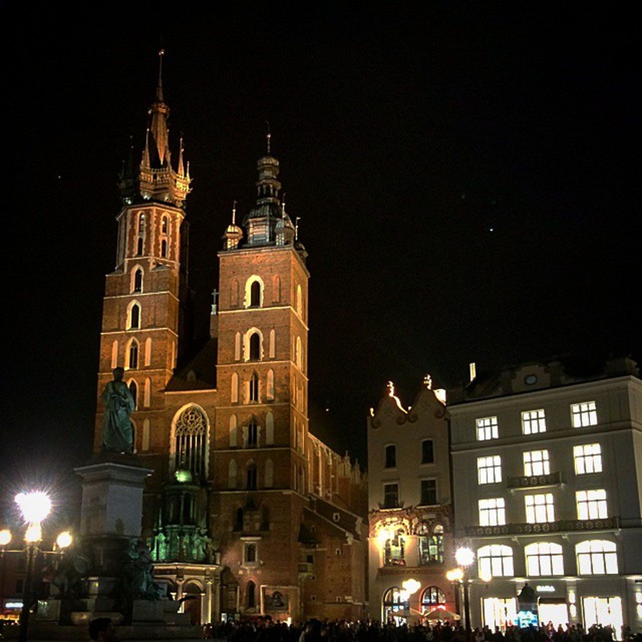 building exterior, architecture, built structure, night, illuminated, low angle view, city, church, religion, sky, street light, facade, travel destinations, clear sky, place of worship, cathedral, tower, history, famous place