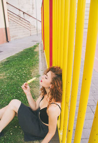 Beautiful young woman holding umbrella