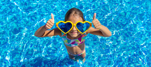 Young woman swimming in pool