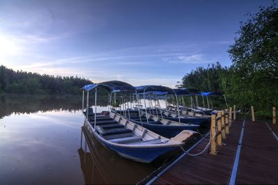 View of boats moored in calm lake