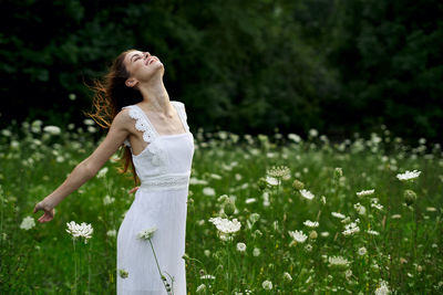 Full length of woman standing on field