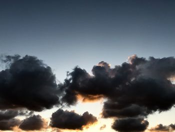 Low angle view of clouds in sky during sunset