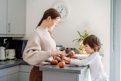 Mother and daughter holding ice cream