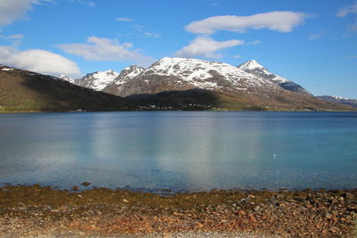 Scenic view of lake and mountains against sky