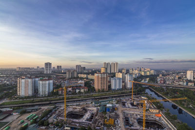 High angle view of road amidst buildings in city against sky