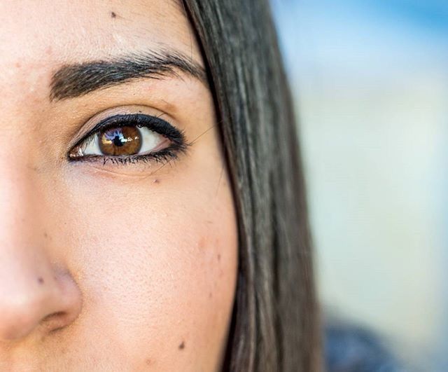 close-up, headshot, human face, lifestyles, person, young adult, young women, looking at camera, portrait, focus on foreground, leisure activity, human eye, part of, front view, indoors, human skin