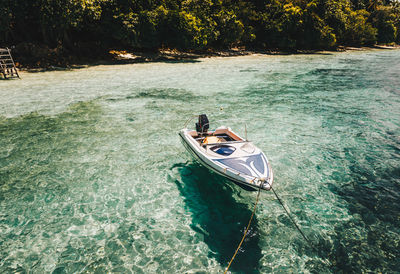 High angle view of boat moored in water