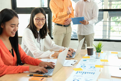 Group of people working on table