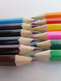 Close-up of colored pencils on table