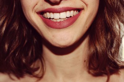 Midsection of smiling woman