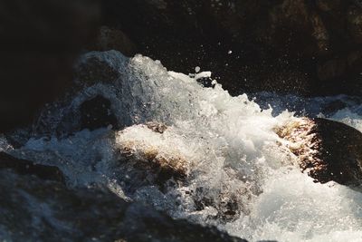 Close-up of water splashing on rocks