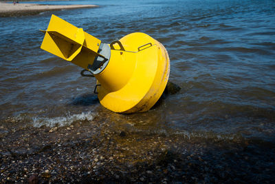 High angle view of yellow floating on sea