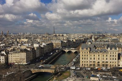 Cityscape against cloudy sky